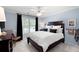 Bedroom featuring blue walls, a dark wood bed frame, and neutral-colored carpet at 6061 Meridian Nw Dr, Acworth, GA 30101