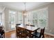 Bright dining room with ample natural light and a wooden table at 6061 Meridian Nw Dr, Acworth, GA 30101