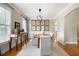 Formal dining room featuring wainscoting, and a modern chandelier at 6061 Meridian Nw Dr, Acworth, GA 30101