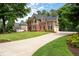 Beautiful home with an expansive driveway and lush green lawn in a peaceful neighborhood at 6061 Meridian Nw Dr, Acworth, GA 30101