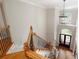Grand foyer with wood stairs, wrought iron railings, and high ceilings at 6061 Meridian Nw Dr, Acworth, GA 30101