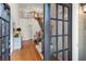 Grand foyer featuring hardwood floors, a staircase with wrought iron railings, and soaring ceilings at 6061 Meridian Nw Dr, Acworth, GA 30101