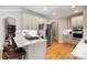 Modern kitchen features stainless steel appliances and an island with seating at 6061 Meridian Nw Dr, Acworth, GA 30101