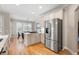 Open-concept kitchen with stainless steel appliances and granite countertops at 6061 Meridian Nw Dr, Acworth, GA 30101