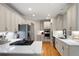 Bright kitchen with hardwood floors, stainless steel appliances, and white countertops at 6061 Meridian Nw Dr, Acworth, GA 30101