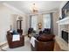 Comfortable seating arrangements surround the stone fireplace, creating a cozy atmosphere at 6061 Meridian Nw Dr, Acworth, GA 30101