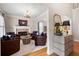 Cozy living room features a stone fireplace, hardwood floors, and comfortable seating at 6061 Meridian Nw Dr, Acworth, GA 30101