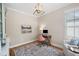 Office with neutral colored walls, wooden floors, and a modern desk setup at 6061 Meridian Nw Dr, Acworth, GA 30101