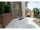 Rear exterior view displays a patio, outdoor seating, and stairs to the upper deck, providing ample space for relaxing at 6061 Meridian Nw Dr, Acworth, GA 30101