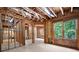 Spacious unfinished room with exposed beams, windows and natural light at 6061 Meridian Nw Dr, Acworth, GA 30101