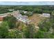 A scenic aerial perspective of a new housing community surrounded by lush green trees at 101 Priestwood Ln, Acworth, GA 30102