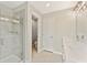 Modern bathroom with a glass-enclosed shower, double vanity, and neutral color palette at 101 Priestwood Ln, Acworth, GA 30102
