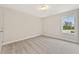 Bedroom featuring neutral carpet, a window with natural light, and a closet at 101 Priestwood Ln, Acworth, GA 30102