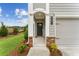 Front entrance featuring brickwork, white pillars and trim, and a landscaped yard at 101 Priestwood Ln, Acworth, GA 30102