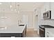 Stylish kitchen with an island, white countertop and cabinets, and stainless steel appliances at 101 Priestwood Ln, Acworth, GA 30102