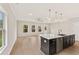 Open concept kitchen and living room with island and plenty of natural light at 101 Priestwood Ln, Acworth, GA 30102