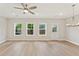 Bright living room with light wood floors, ceiling fan, recessed lighting, and natural light at 101 Priestwood Ln, Acworth, GA 30102