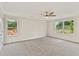 Large main bedroom featuring plush carpeting, a ceiling fan, and lots of natural light at 101 Priestwood Ln, Acworth, GA 30102