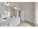 Well lit bathroom featuring double vanity with marble countertops at 2239 Noelle Pl, Powder Springs, GA 30127
