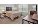 Cozy bedroom featuring a plush bed, warm lighting, and neutral tones creating a relaxing atmosphere at 2239 Noelle Pl, Powder Springs, GA 30127