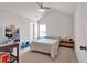 Bright bedroom with plush carpet, a ceiling fan, a window and a neutral color scheme at 2239 Noelle Pl, Powder Springs, GA 30127