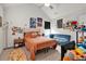 Bright bedroom with comfortable bed, decorative posters and a cozy blue sofa at 2239 Noelle Pl, Powder Springs, GA 30127