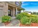 Well-manicured front yard with lush greenery and a charming walkway leading to the front door at 2239 Noelle Pl, Powder Springs, GA 30127