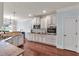 Modern kitchen with white cabinets, stainless steel appliances and granite countertops at 2239 Noelle Pl, Powder Springs, GA 30127