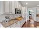 Kitchen with stainless steel appliances, granite countertops, and a breakfast bar at 2239 Noelle Pl, Powder Springs, GA 30127