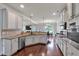 Spacious kitchen featuring stainless appliances, granite counters, and hardwood floors at 2239 Noelle Pl, Powder Springs, GA 30127
