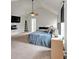 Vaulted ceiling in a main bedroom with carpeting and a flat screen tv at 2239 Noelle Pl, Powder Springs, GA 30127