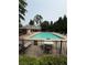 Community swimming pool with lounge chairs and tables for relaxation at 2239 Noelle Pl, Powder Springs, GA 30127