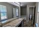 This bathroom offers double sinks with granite countertop and separate tub at 315 Marley Dr, Atlanta, GA 30349