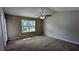 This bedroom has neutral walls, carpet flooring, ceiling fan and a bright window at 315 Marley Dr, Atlanta, GA 30349