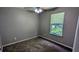 This bedroom offers carpet flooring, neutral walls, and a ceiling fan with light at 315 Marley Dr, Atlanta, GA 30349
