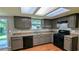 Functional kitchen with ample cabinet space, black appliances, and lots of light at 315 Marley Dr, Atlanta, GA 30349