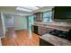 Well-lit kitchen with updated appliances and countertops overlooking the backyard at 315 Marley Dr, Atlanta, GA 30349