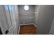 The laundry room features wood floors, washer connections, storage rack, and an octagonal window at 315 Marley Dr, Atlanta, GA 30349
