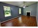 Cozy living room featuring hardwood floors, fireplace, and abundant natural light at 315 Marley Dr, Atlanta, GA 30349