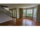 Spacious living room featuring hardwood floors and bay windows at 315 Marley Dr, Atlanta, GA 30349