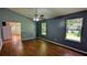 This living room boasts wood floors, natural light from the two windows, and a ceiling fan at 315 Marley Dr, Atlanta, GA 30349