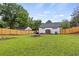 Large fenced backyard with a shed and room for outdoor activities and entertaining at 528 Allendale Dr, Decatur, GA 30032