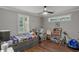 Bright bedroom designed for a , featuring playful decor, natural light, and hardwood floors at 528 Allendale Dr, Decatur, GA 30032