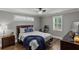 Comfortable bedroom features a ceiling fan, plantation shutters, and modern décor, creating a serene space at 528 Allendale Dr, Decatur, GA 30032