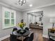 Cozy dining area with modern black table, stylish lighting, and open view to the inviting living room at 528 Allendale Dr, Decatur, GA 30032