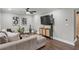 Inviting living room featuring hardwood floors, contemporary furnishings, and neutral decor at 528 Allendale Dr, Decatur, GA 30032