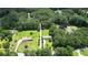 Aerial perspective highlighting the home's location amidst a lush, wooded landscape at 871 Cowan Se Rd, Conyers, GA 30094