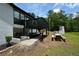 Outdoor space featuring a deck, dining area, and scenic views of the backyard and pond at 871 Cowan Se Rd, Conyers, GA 30094