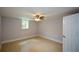 Finished basement bedroom with a ceiling fan and a window offering plenty of natural light at 871 Cowan Se Rd, Conyers, GA 30094