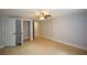 Basement bedroom boasts a ceiling fan, neutral paint and easy access to other rooms at 871 Cowan Se Rd, Conyers, GA 30094